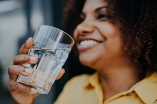 happy woman drinking water