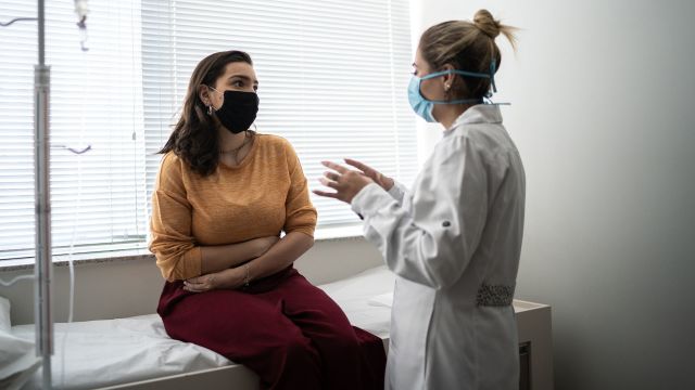 A woman consults with her gastroenterologist.