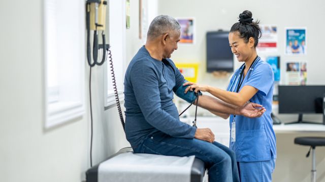 A man in his 50s has his blood pressure taken at a healthcare appointment. Adhering to treatment and keeping up with healthcare appointments are essential to successful hepatitis C treatment.