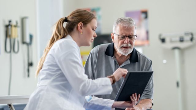 Doctor giving treatment recommendations to a mature man diagnosed with colon cancer