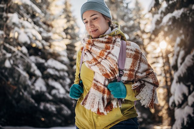 young woman hiking in cold weather
