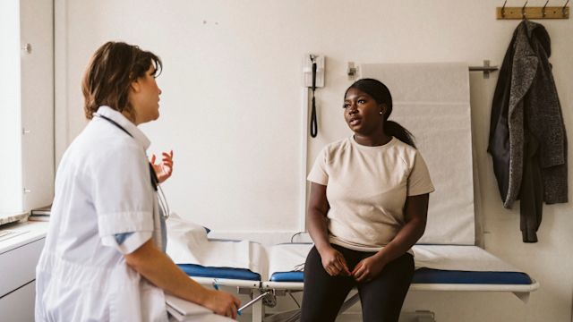 A young Black woman talks to her doctor about treatment for beta thalassemia, and the possibility of treating this condition with gene therapy.