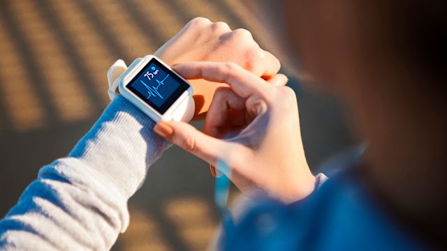 A woman monitors her heart rate with a smart watch. Diabetes can affect the health of the heart in a number of ways.