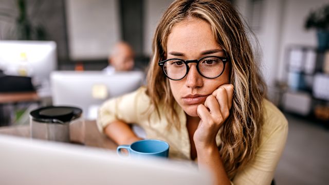 stressed woman at office job