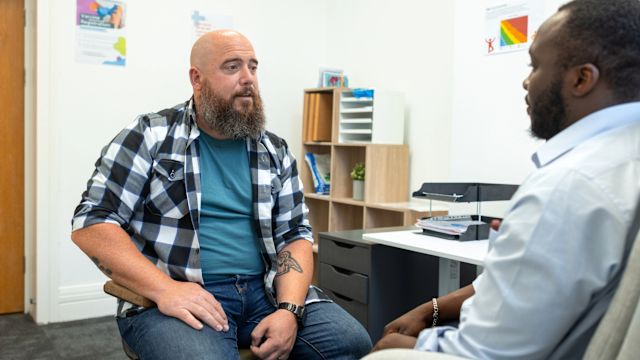 A middle aged man talks to his healthcare provider about his treatment options for MASLD. Treatment for MASLD can involve taking several medications.