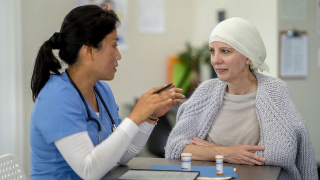 A senior woman being treated for endometrial cancer talks to her healthcare provider about treatment options for cancer that not responded to treatment.