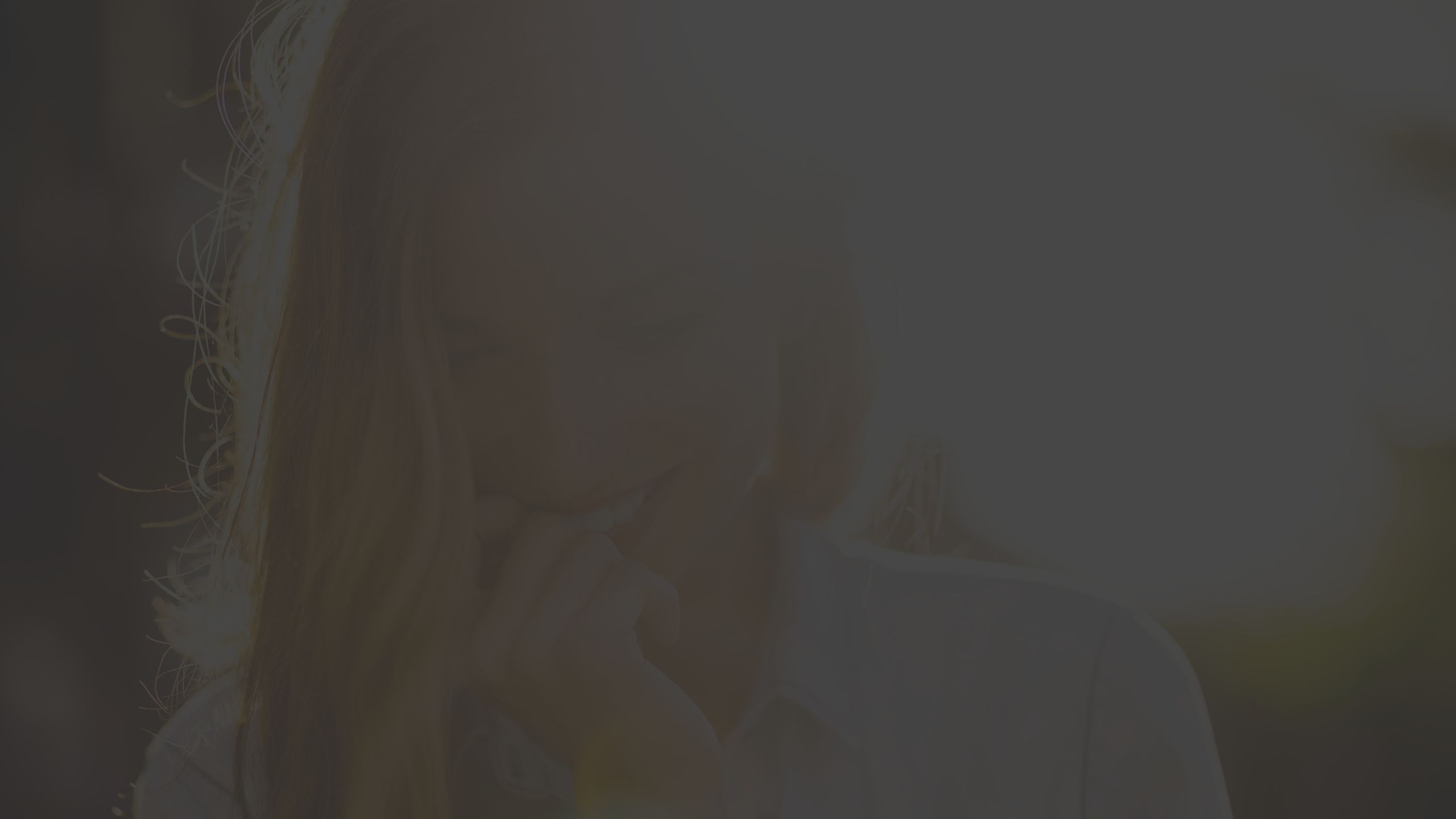 shy woman with sun behind her