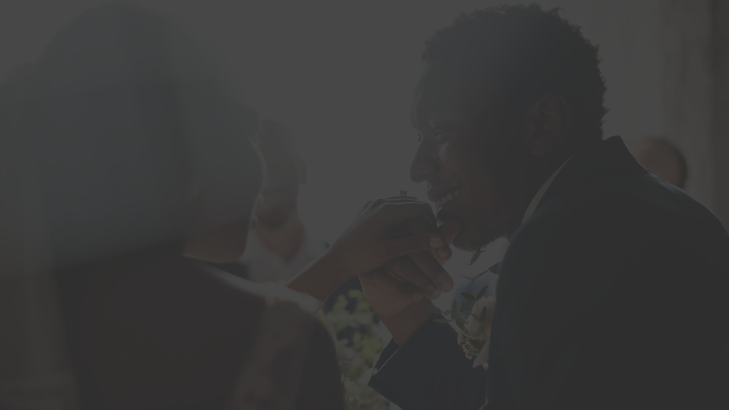 married couple, man kissing wife's hand, wedding day