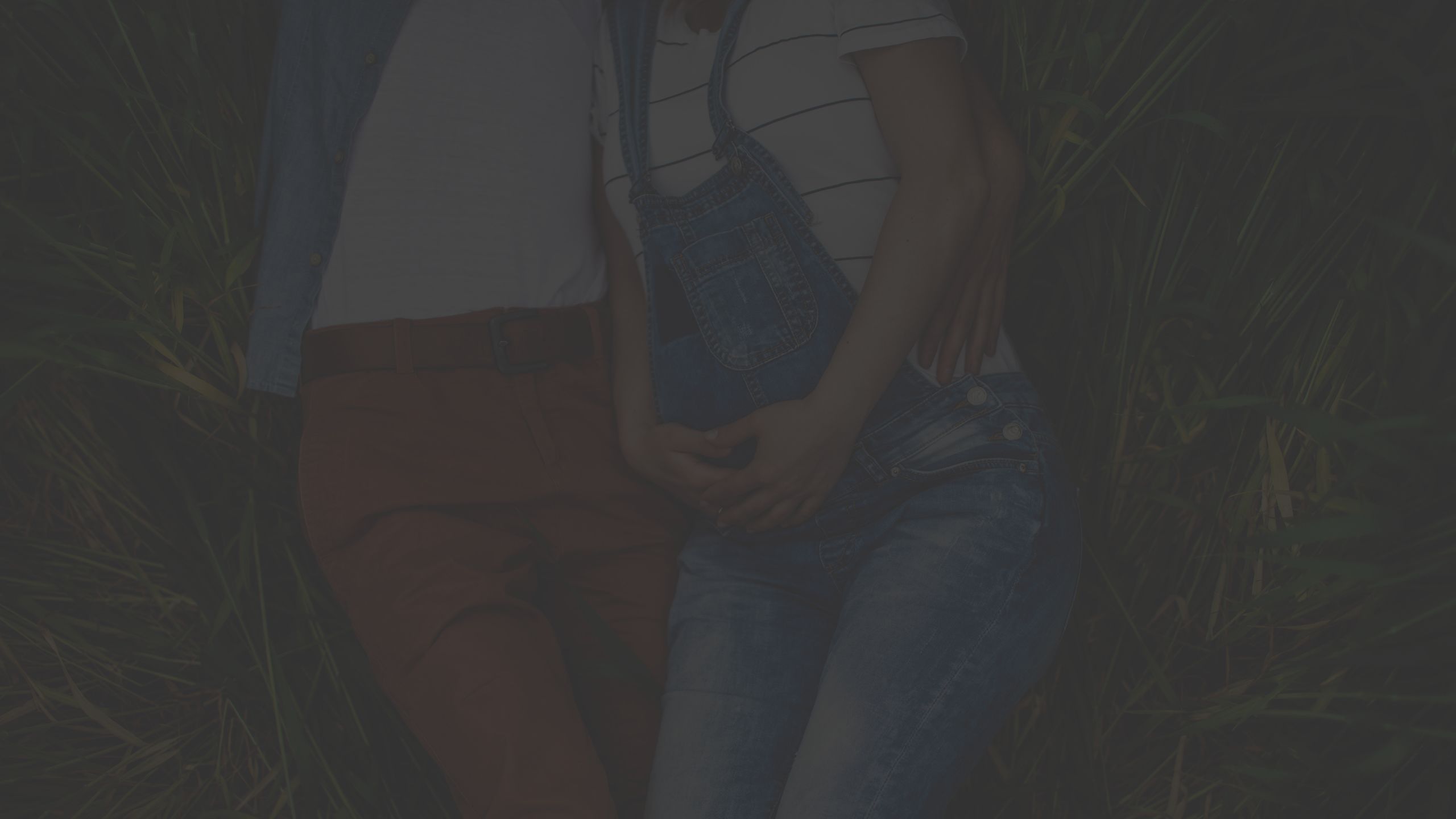 man and woman in a field, pregnant woman, overalls