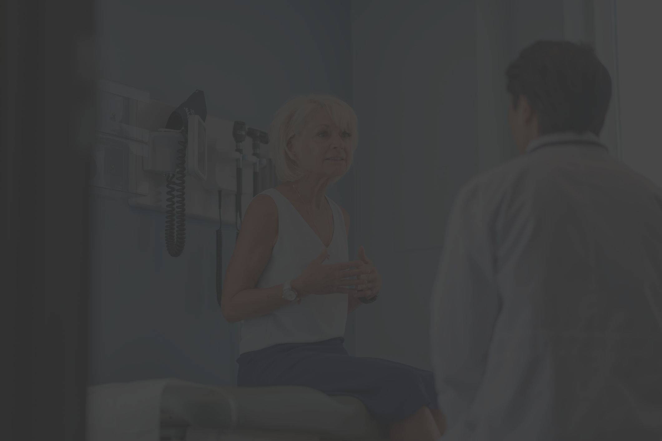 woman consulting with healthcare provider in office