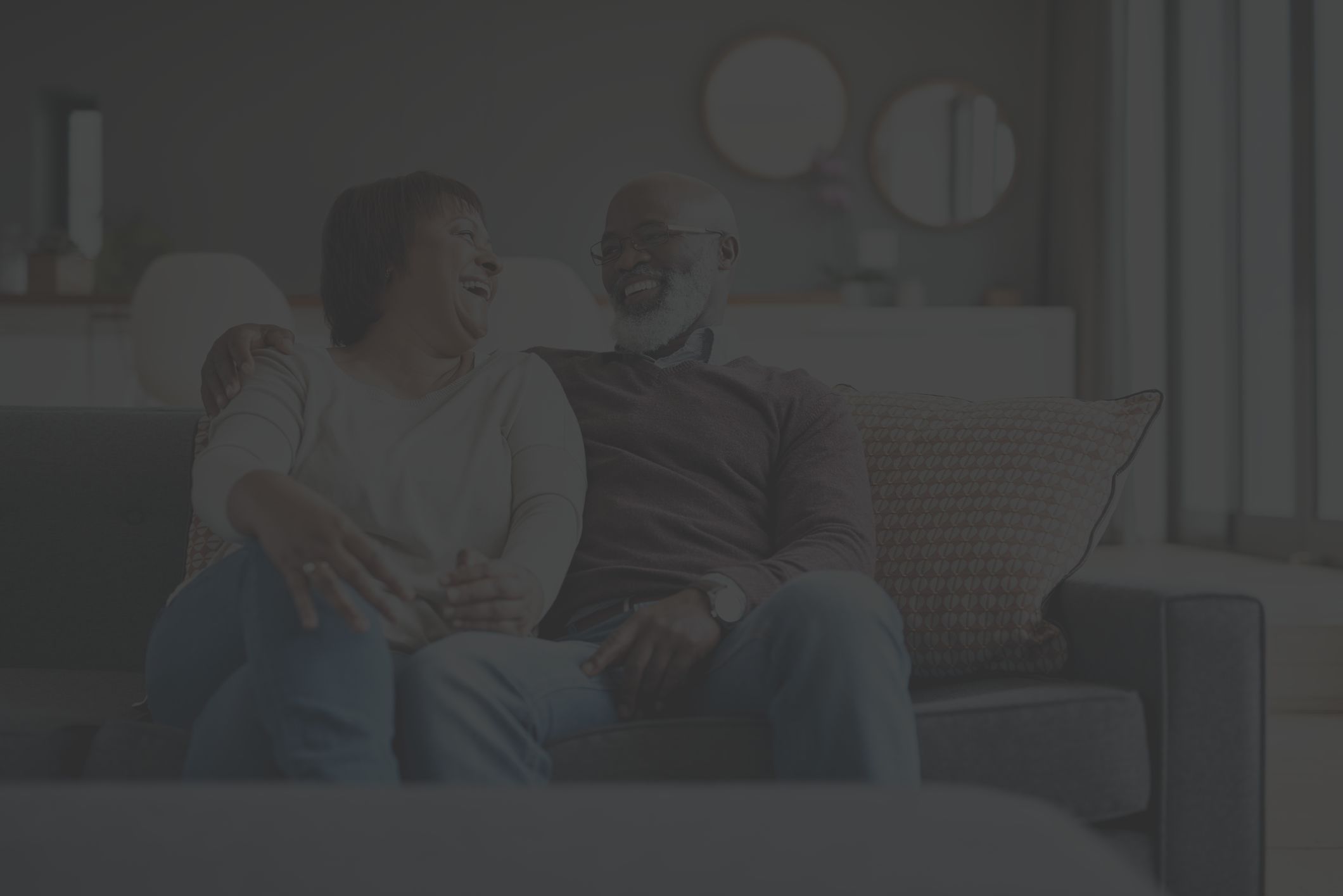 Happy mature couple relaxing at home