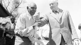 Gough Whitlam formally hands back land to the Gurindji people, pouring soil into the hands of elder Vince Lingiari.