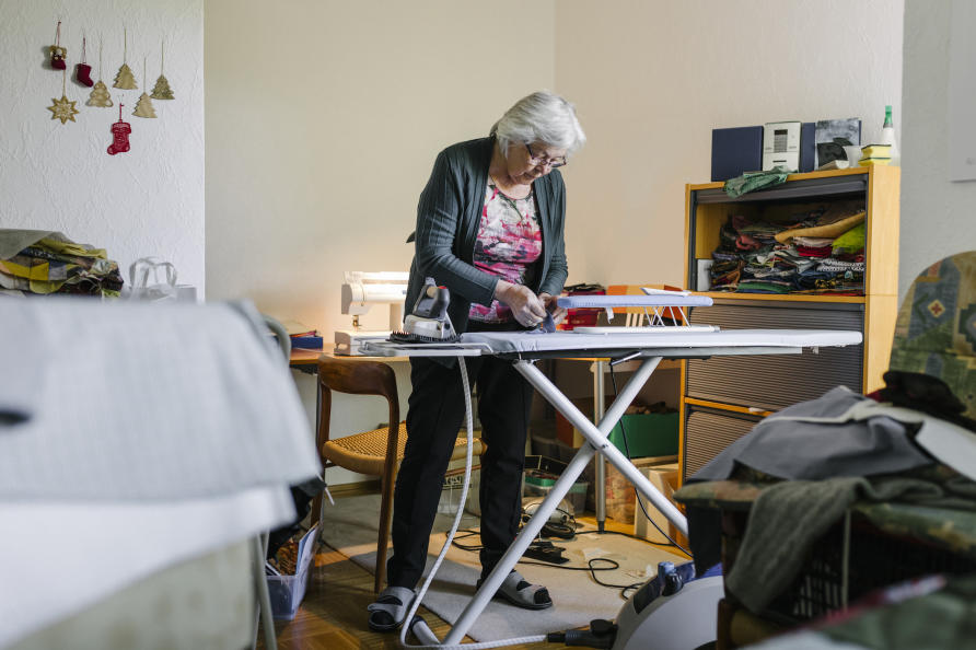 Women standing at an ironing board