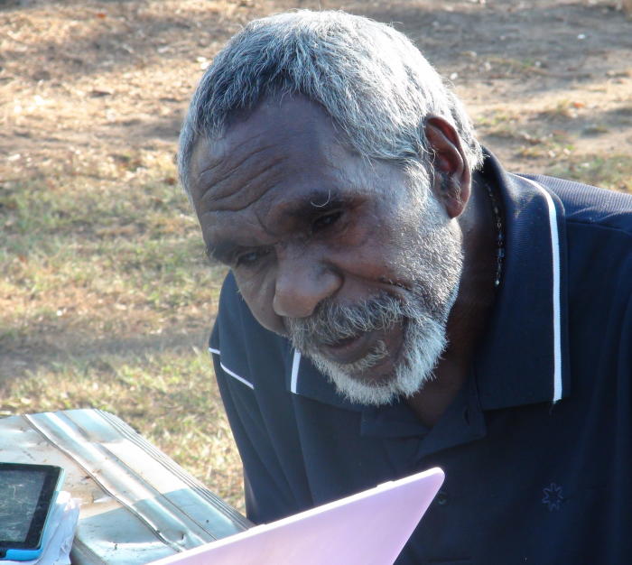 Damien Tunmuck listening to a recording Dr Green made in 1990 of his late father Johnny Chula speaking the Magati Ke language, of which there are no fluent speakers left. Picture: Associate Professor Rachel Nordlinger.