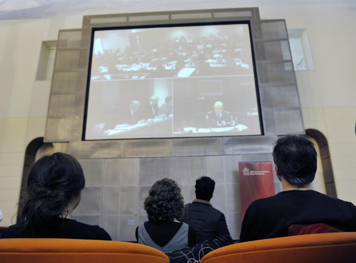 The Royal Commission hearings into the Black Saturday bushfires were streamed to onlookers outside the room. Picture: William West/AFP/Getty Images