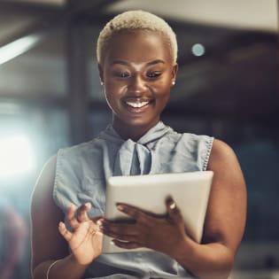 Square image of woman working on iPad